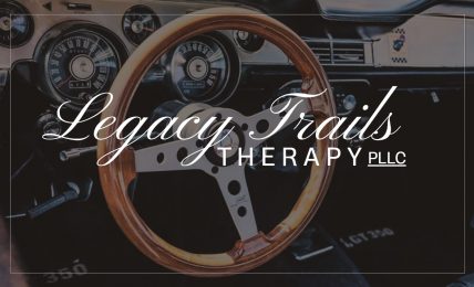 Car dashboard with a steering wheel and instrument panel, overlaid with text 'Legacy Trails Therapy LLC'.