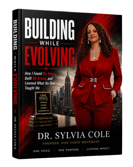 Book cover titled 'Building While Evolving' features a woman in a red blazer with city skyline background.